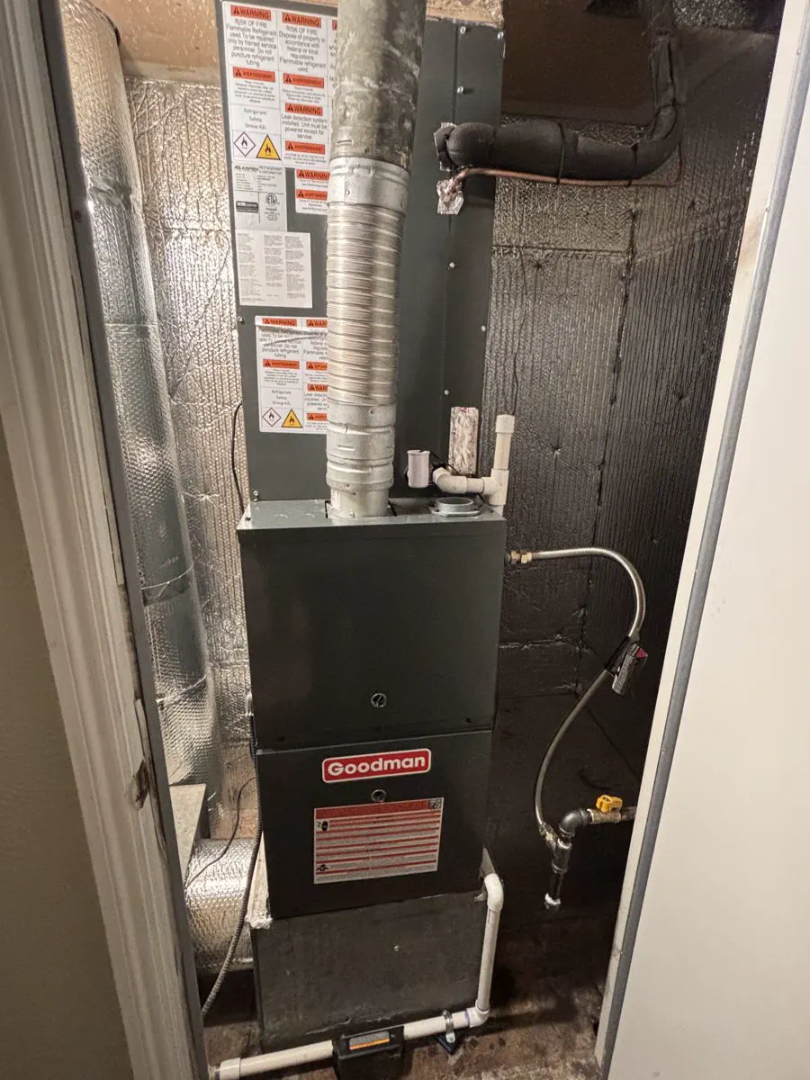 A furnace installed in an attic space with flex ducting