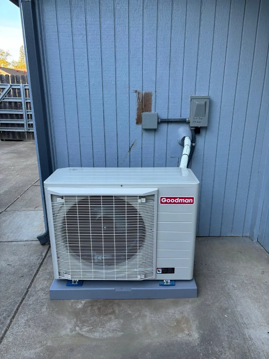 A Goodman ductless mini-split outdoor unit on a concrete pad