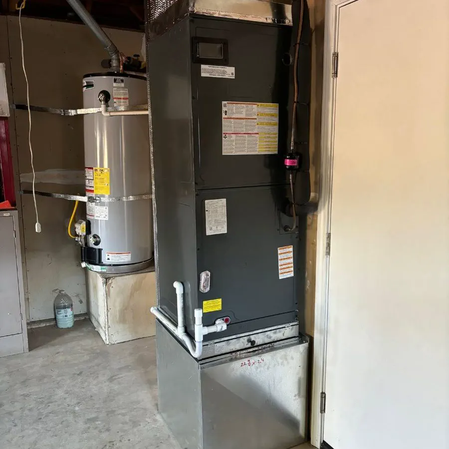 A new furnace and air handler installed in a garage